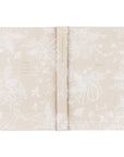 Floral-patterned notebook with text on a white background