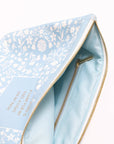 Light blue pouch with floral pattern and gold zipper on a white background