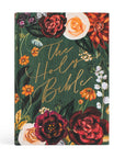 Floral design book cover with 'The Holy Bible' text on a white background