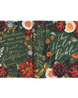 Floral decorated Bible cover with text on a white background