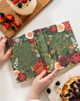Floral notebook covers on a table with pastries