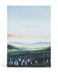 Holy Bible with a scenic cover design on a white background