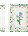 Decorative book cover with floral design and intricate patterns on a white background