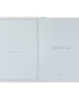 Open notebook with light blue pages on a white background