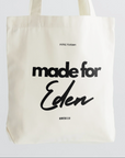 Beige tote bag with 'made for Eden' text on a white background