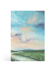 Journal with a scenic cover featuring a river and mountains, on a white background