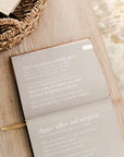 Open book with text on a wooden surface