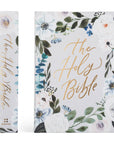 Floral decorated Bible cover with 'The Holy Bible' text on a white background