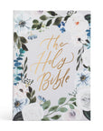Floral design cover of 'The Holy Bible' with gold text on a white background