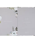 Open book with floral design on a gray background