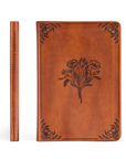 Brown leather notebook with floral design on a white background
