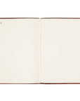 Open notebook with blank pages on a white background