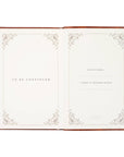 Open notebook with decorative pages and text on a white background