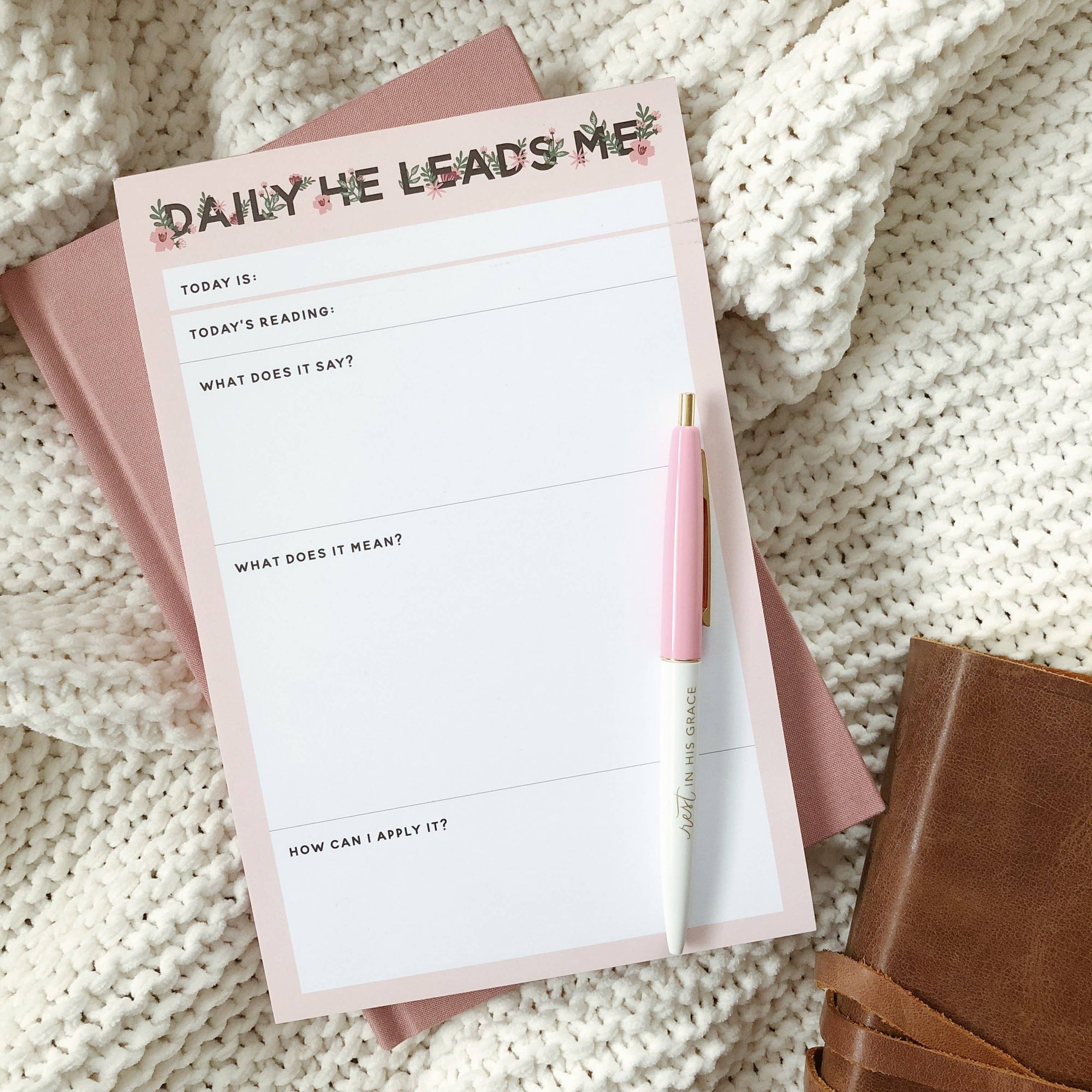 Notepad with a pen on a textured surface