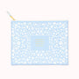 Light blue pouch with white floral pattern and gold text on a white background