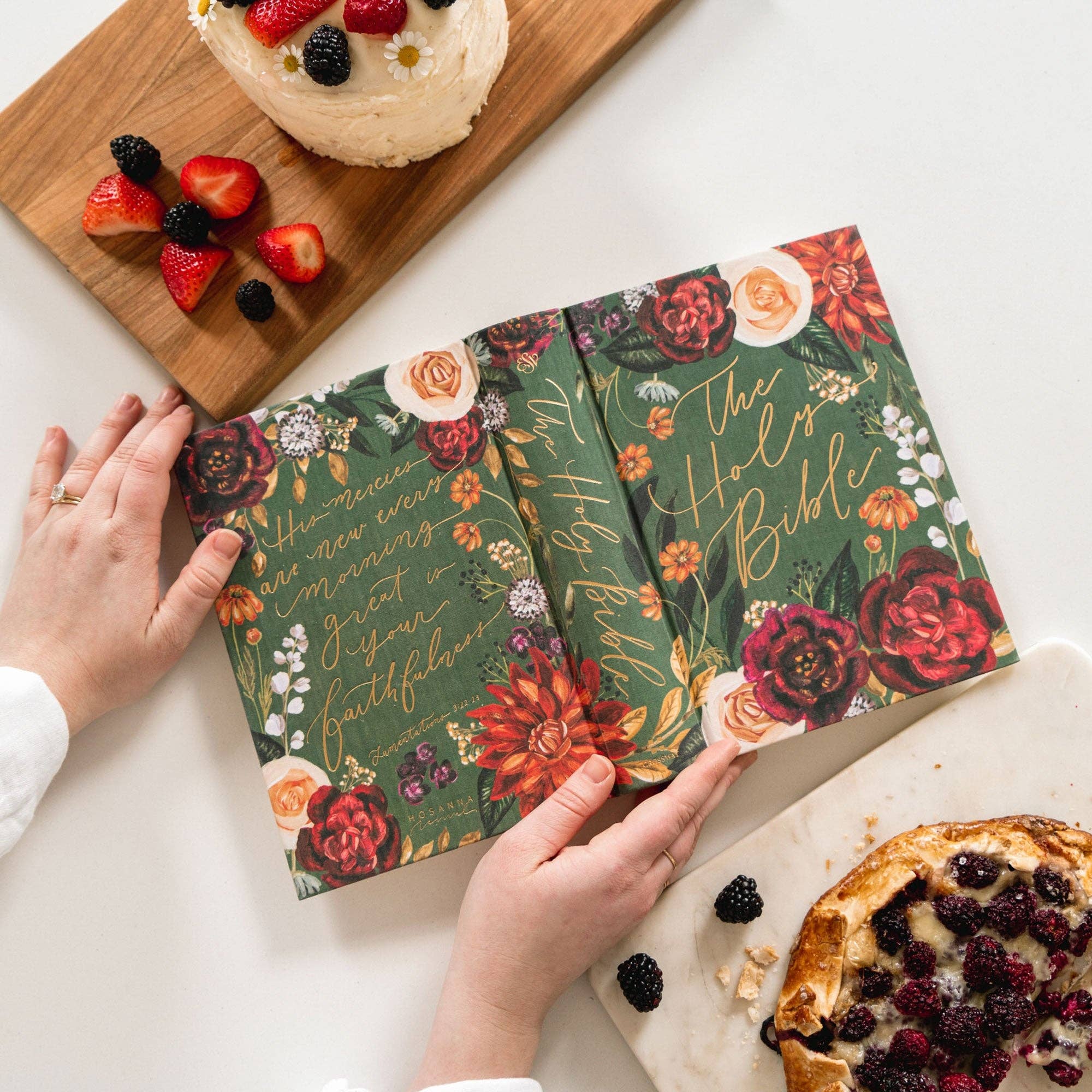 Floral notebook covers on a table with pastries