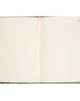 Open notebook with floral design on the cover on a white background