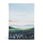 Holy Bible with a scenic cover design on a white background