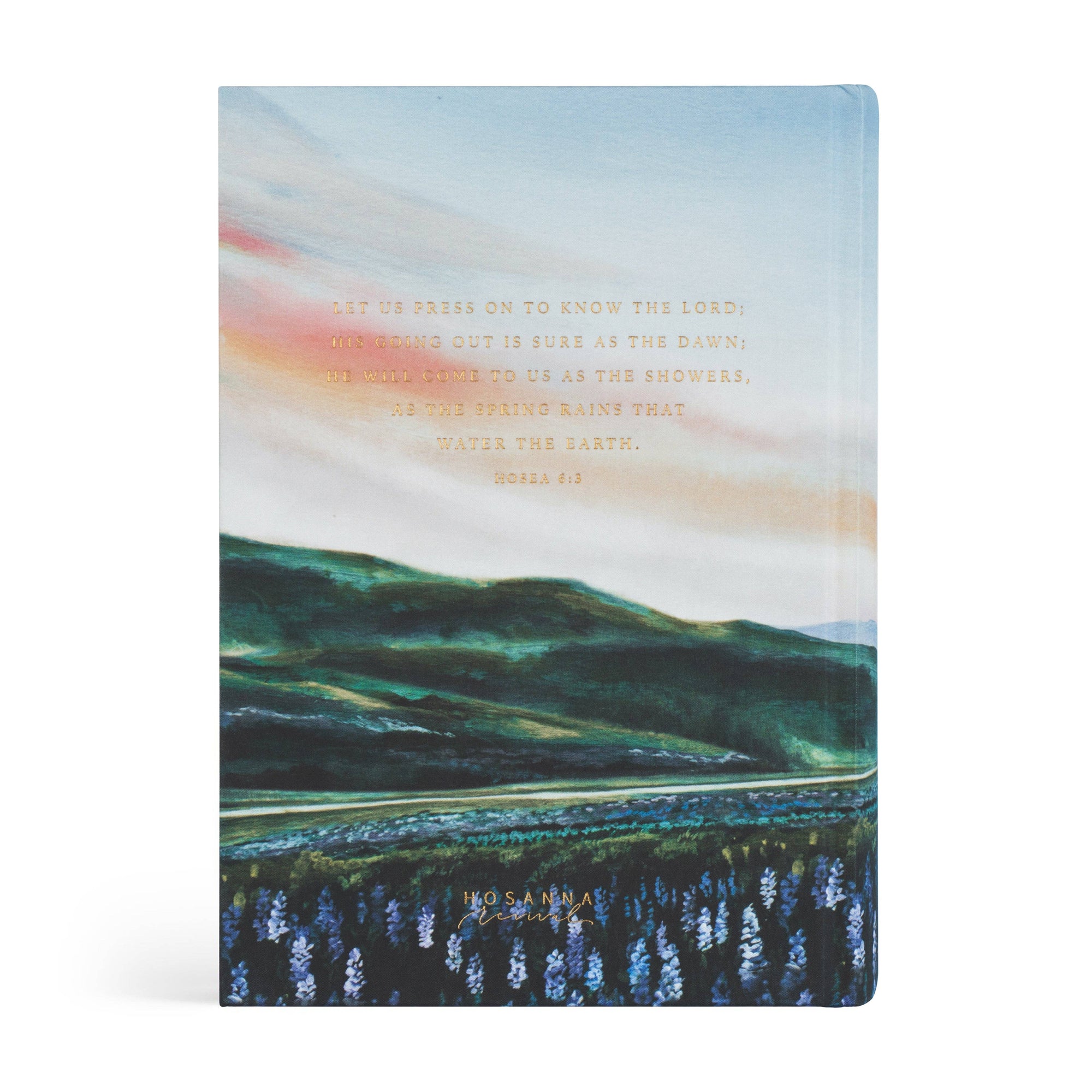 Notebook with a scenic design of mountains and water, featuring text on a white background.