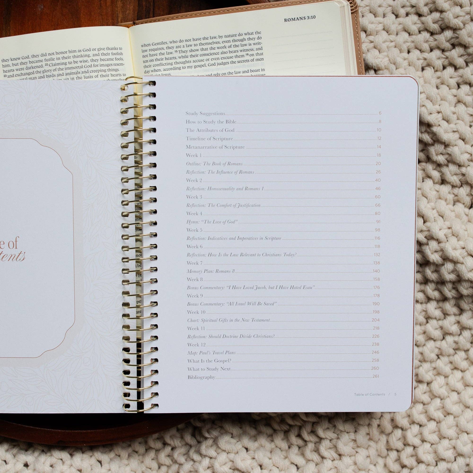 Open planner with spiral binding on a textured surface