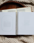 Open notebook on a textured surface