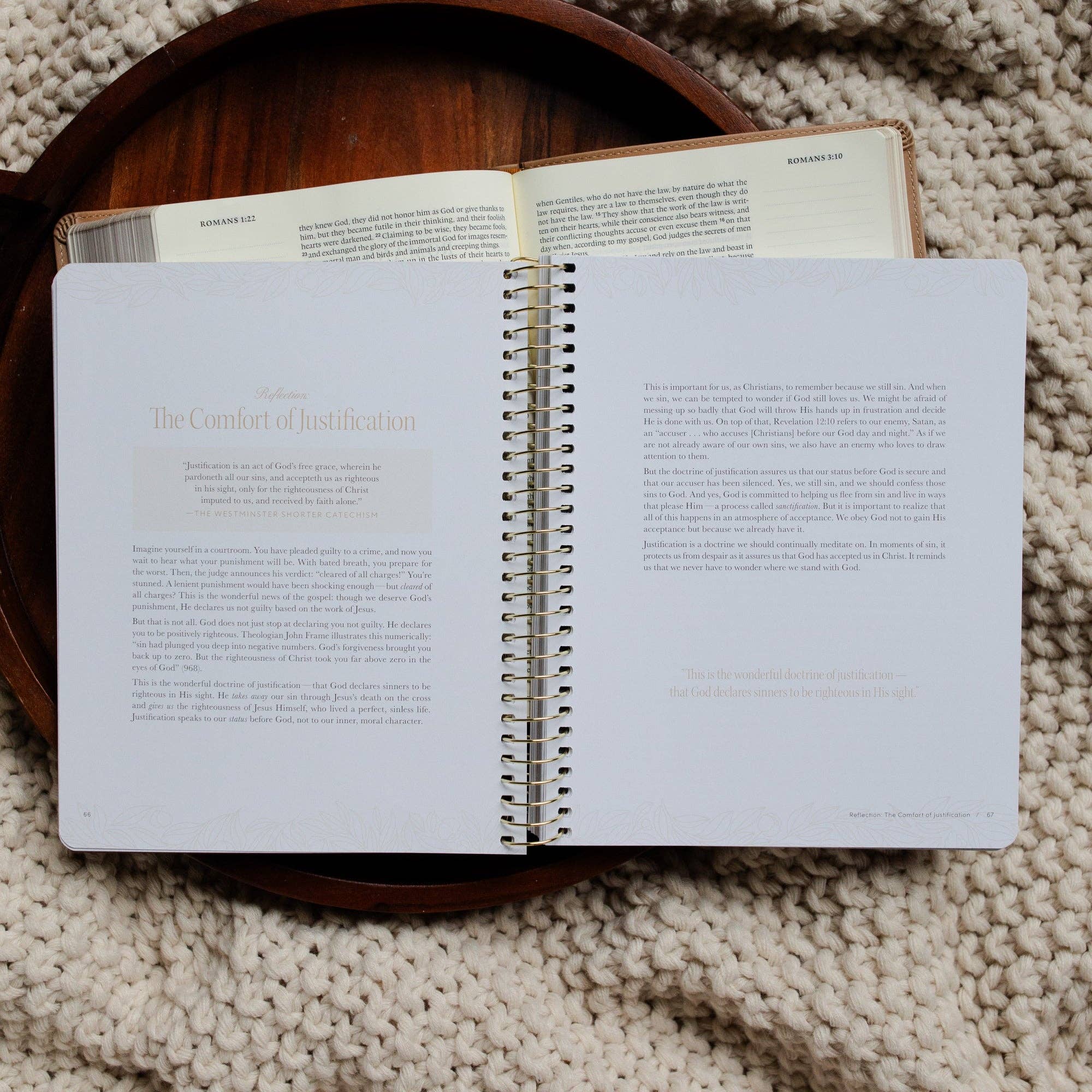 Open spiral-bound book on a textured surface