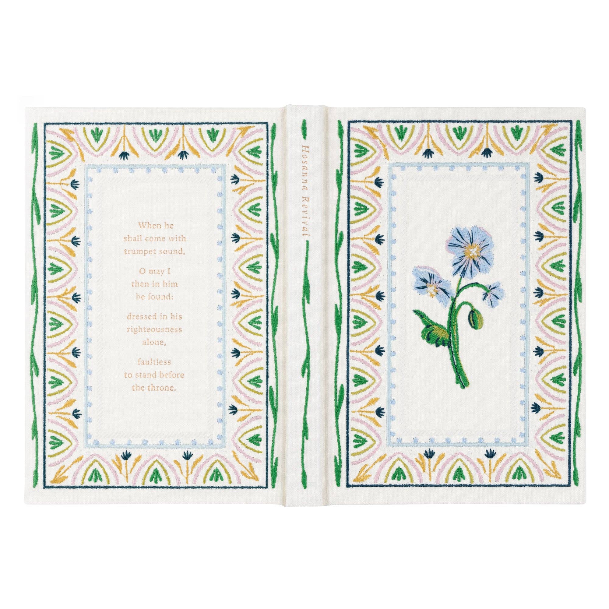Open book with floral design and text on a white background