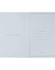 Open book with text on a light blue background