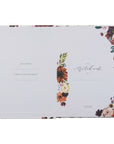 Floral notebook with decorative elements on a white background
