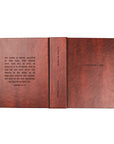 Brown leather notebook with text on a white background