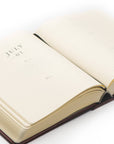 Open book with 'July 01' on a white background