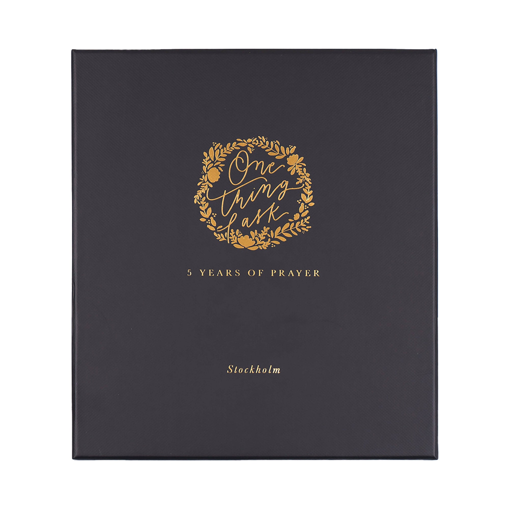 Black book with gold text and design on a white background