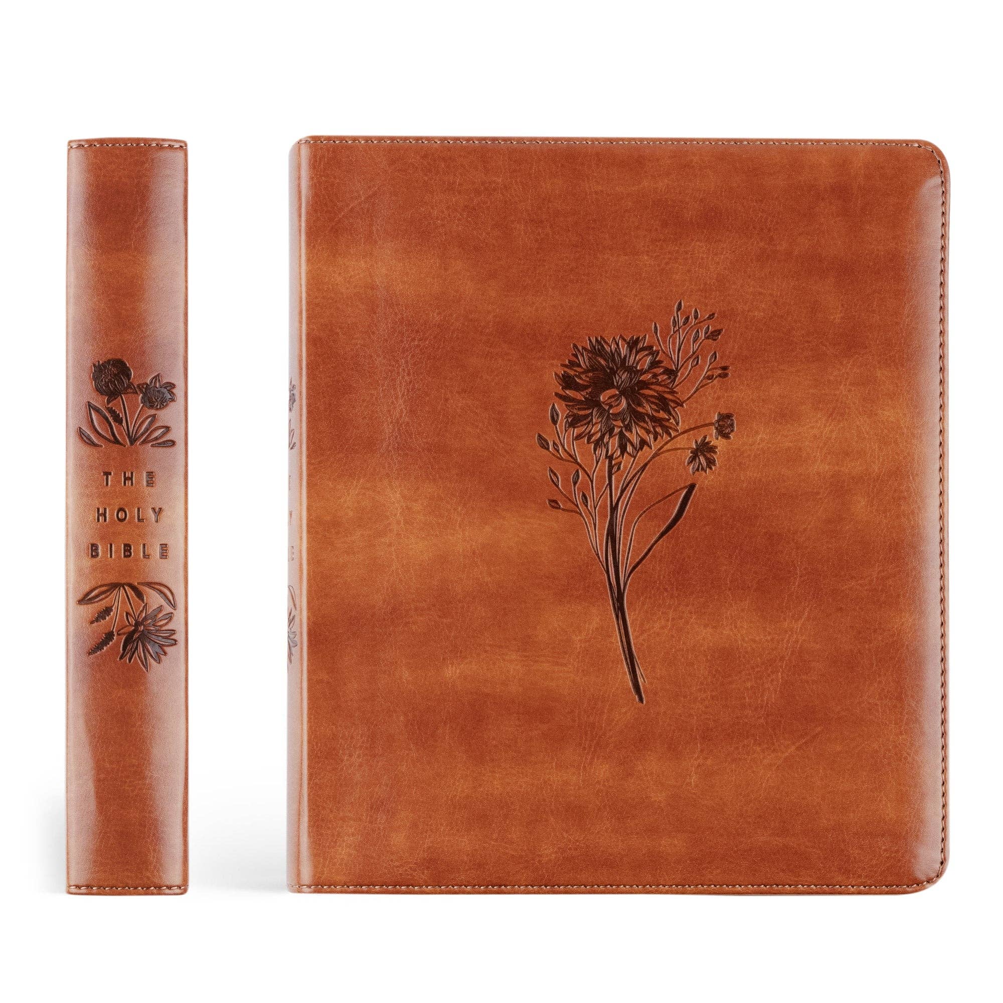 Brown leather-bound book with floral design on a white background
