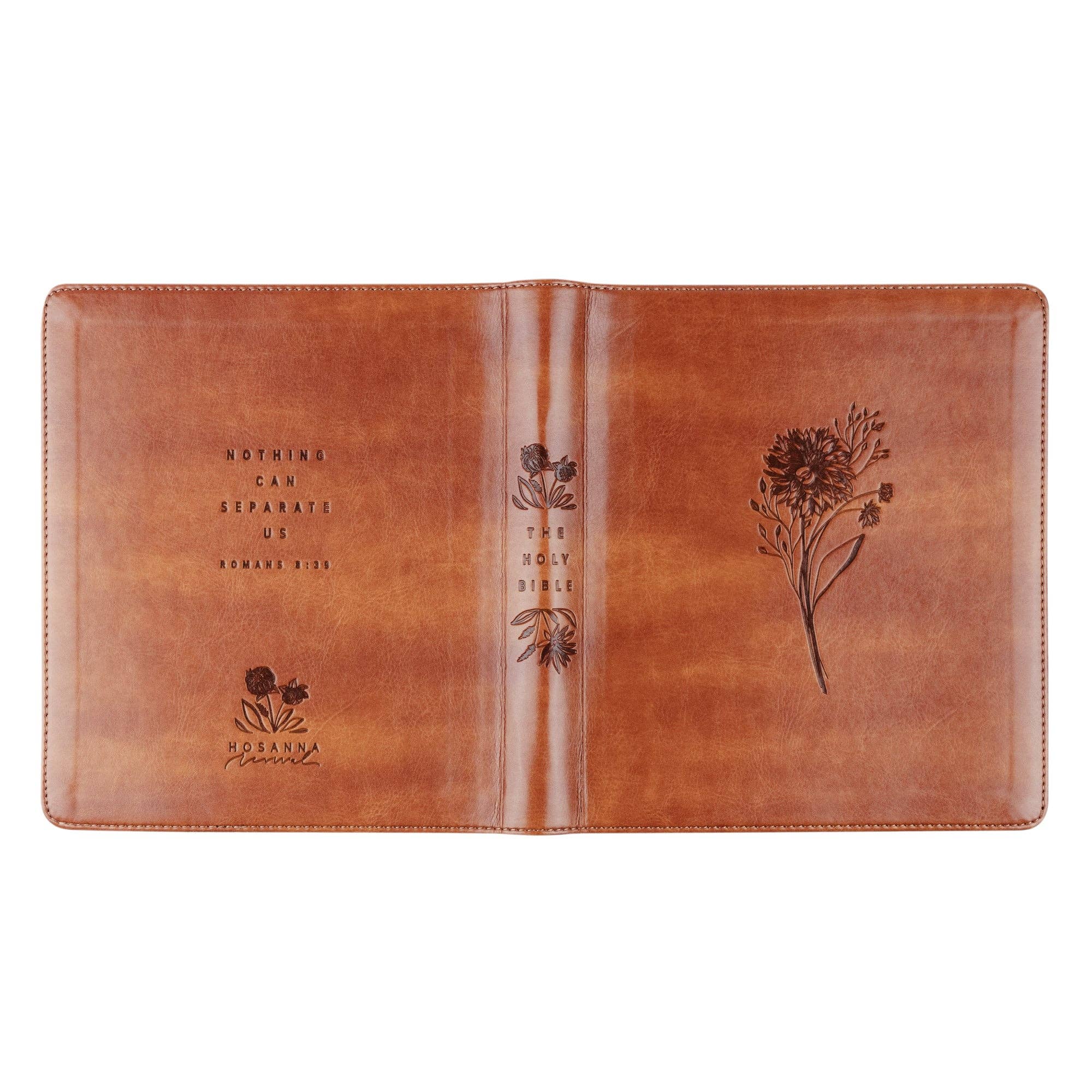 Brown leather Bible cover with floral designs and text on a white background