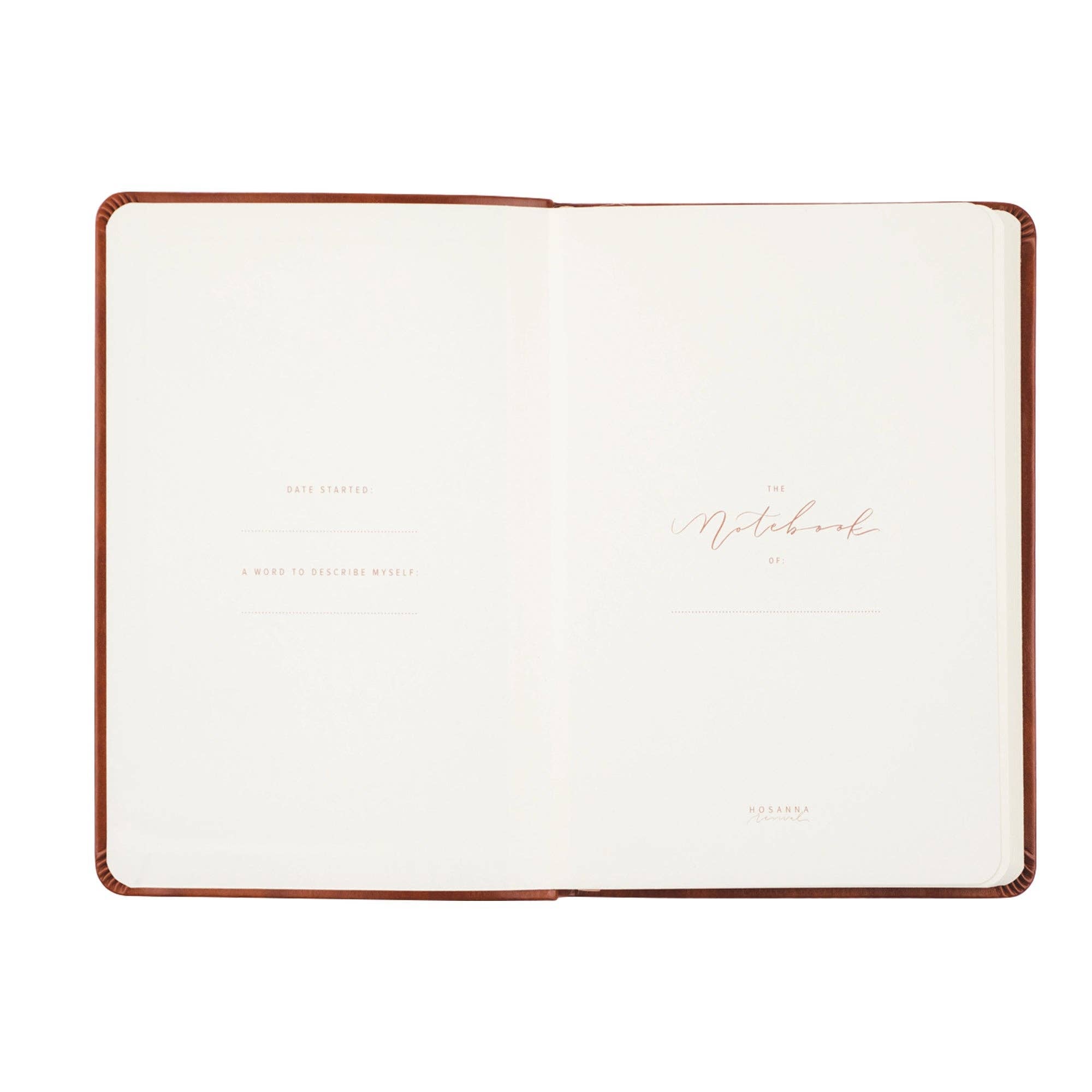 Open notebook with a brown leather cover on a white background