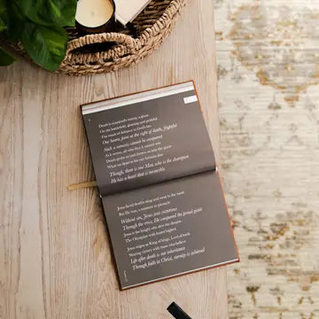 Open book with text on a wooden surface