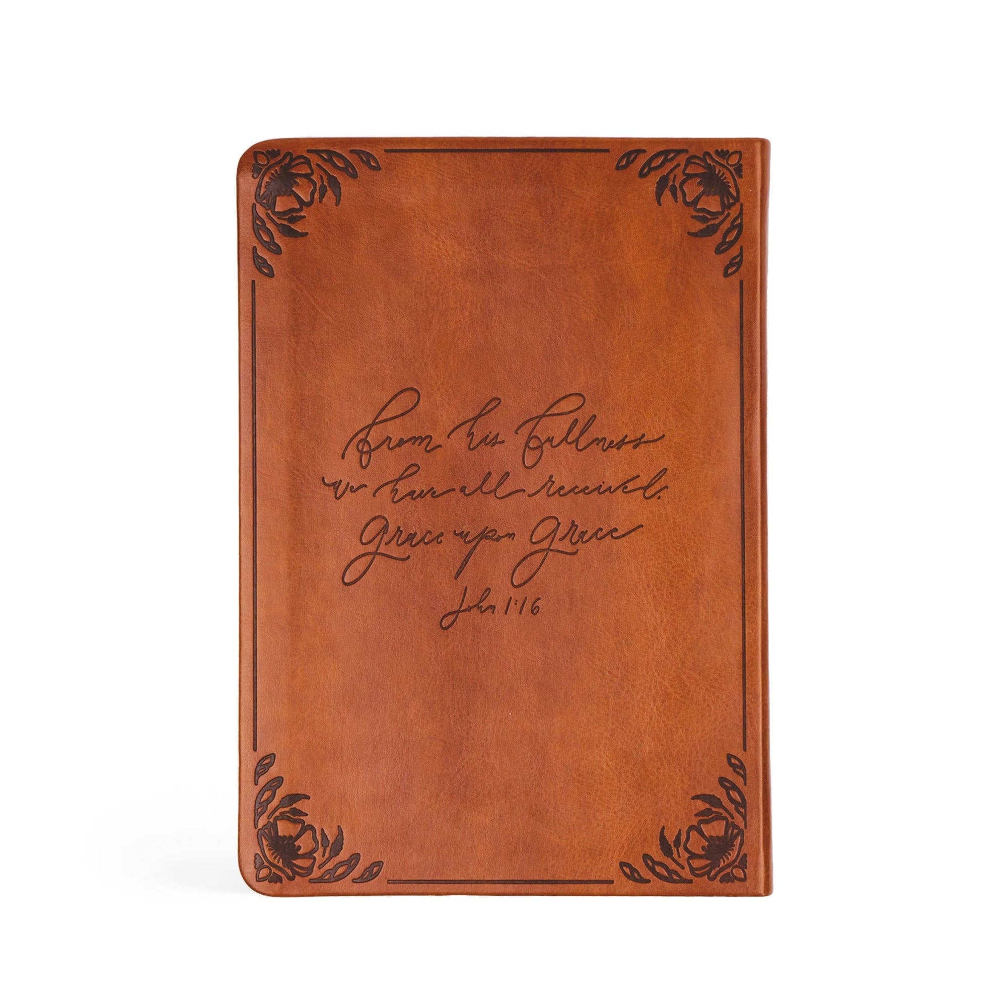 Brown leather notebook with engraved text on a white background