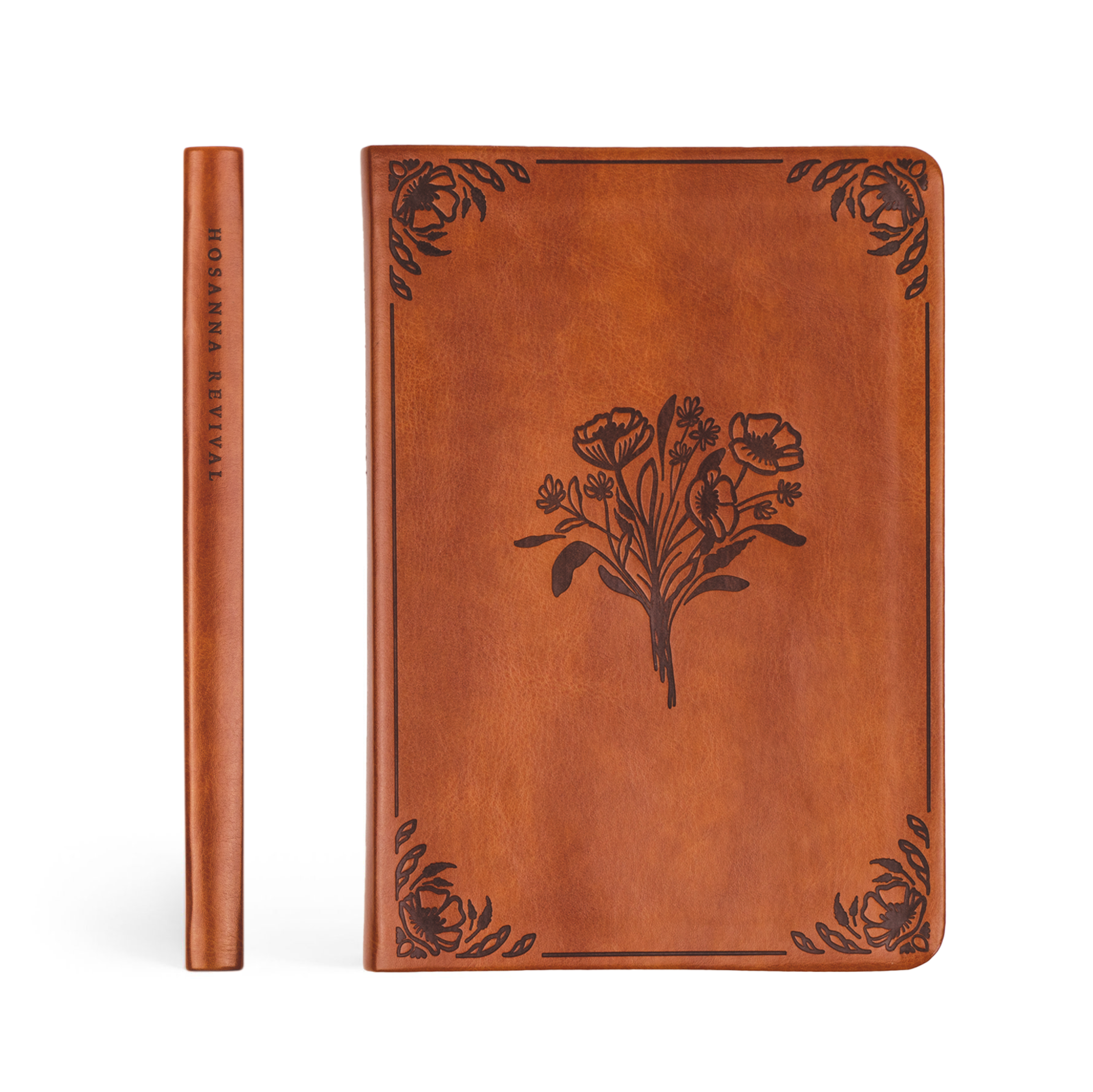 Brown leather notebook with floral design on a white background