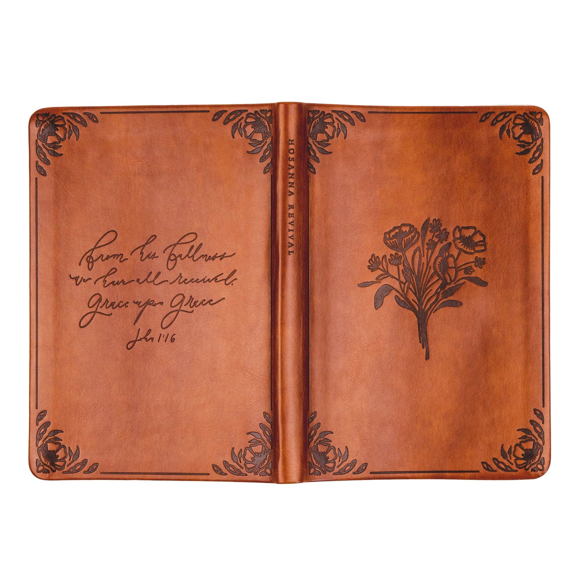 Brown leather notebook with floral design and text on a white background